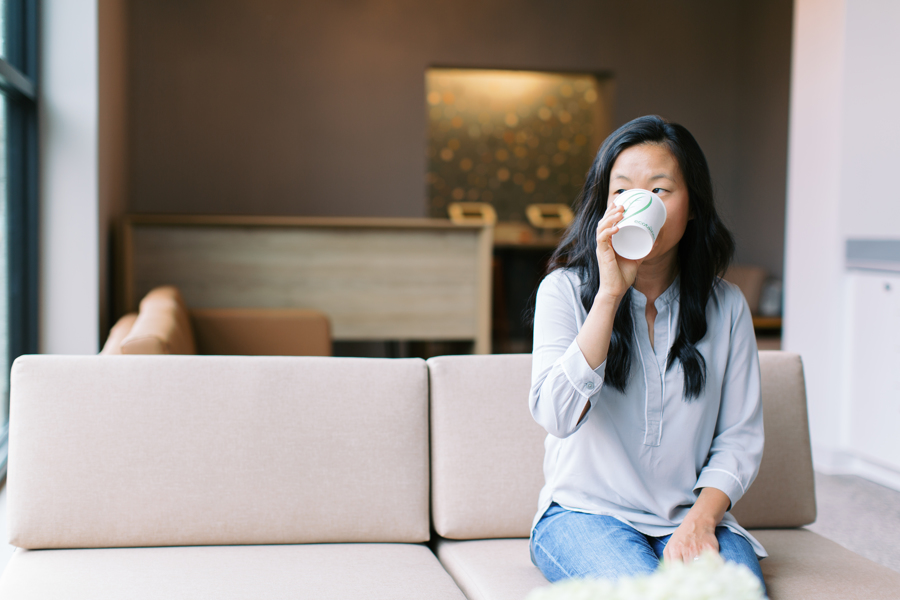 female patient drinking water in orthodontist office